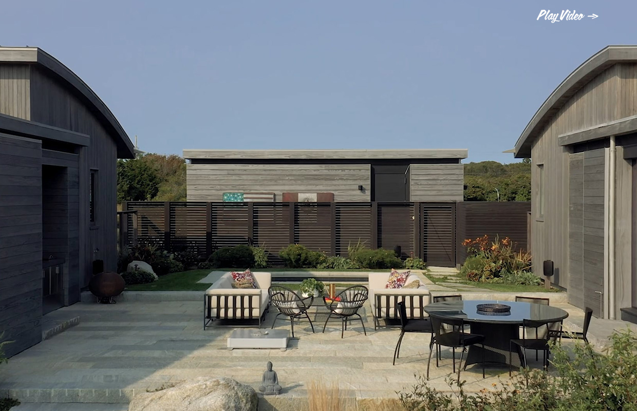 Modern courtyard with seating and wood architecture at Sunset Hill by Hutker Architects